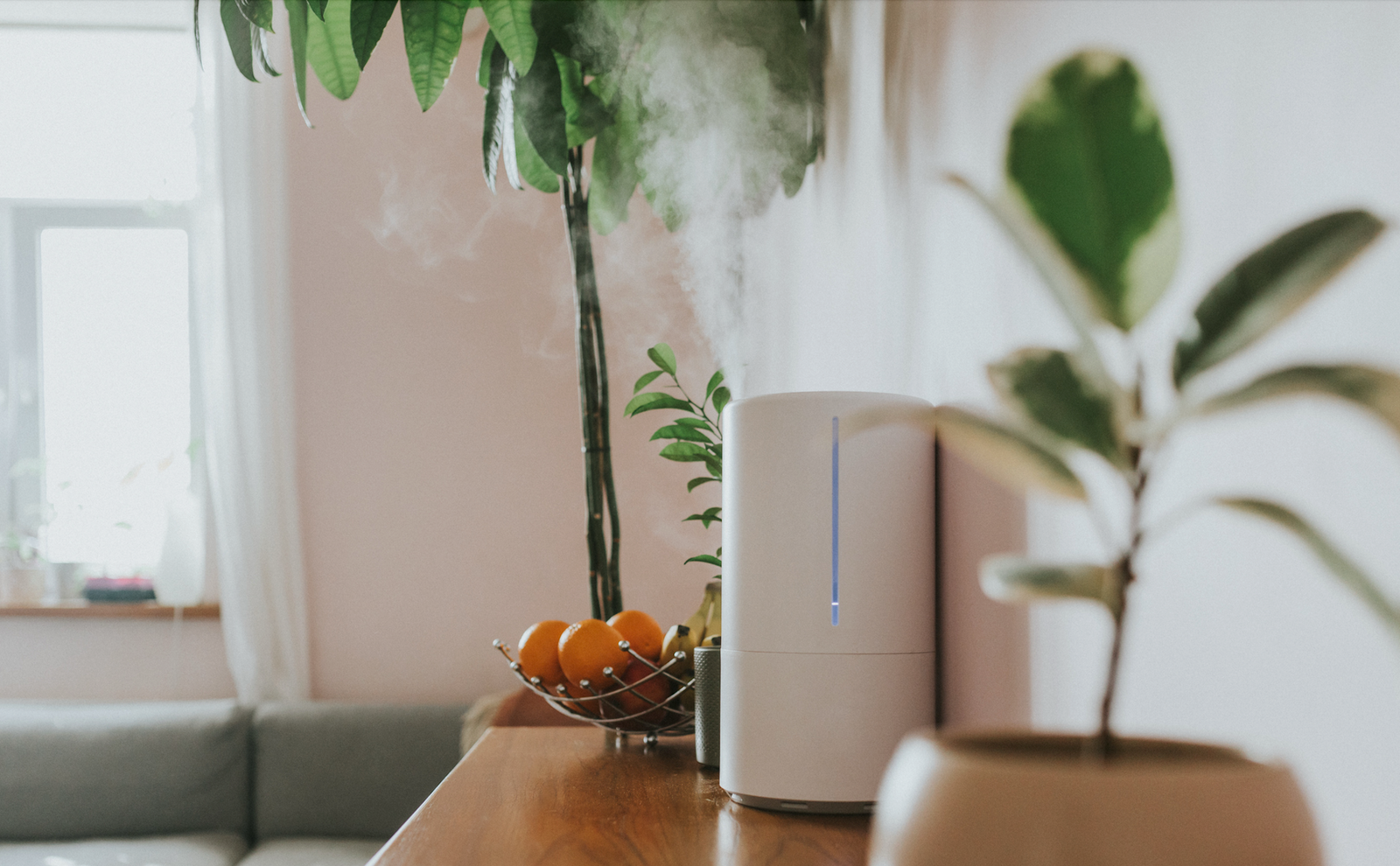 humidifier on a table releasing mist